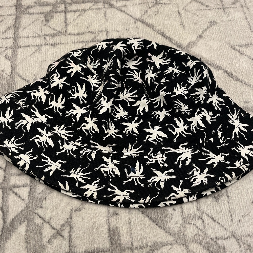 black buckethat with demons/devils
